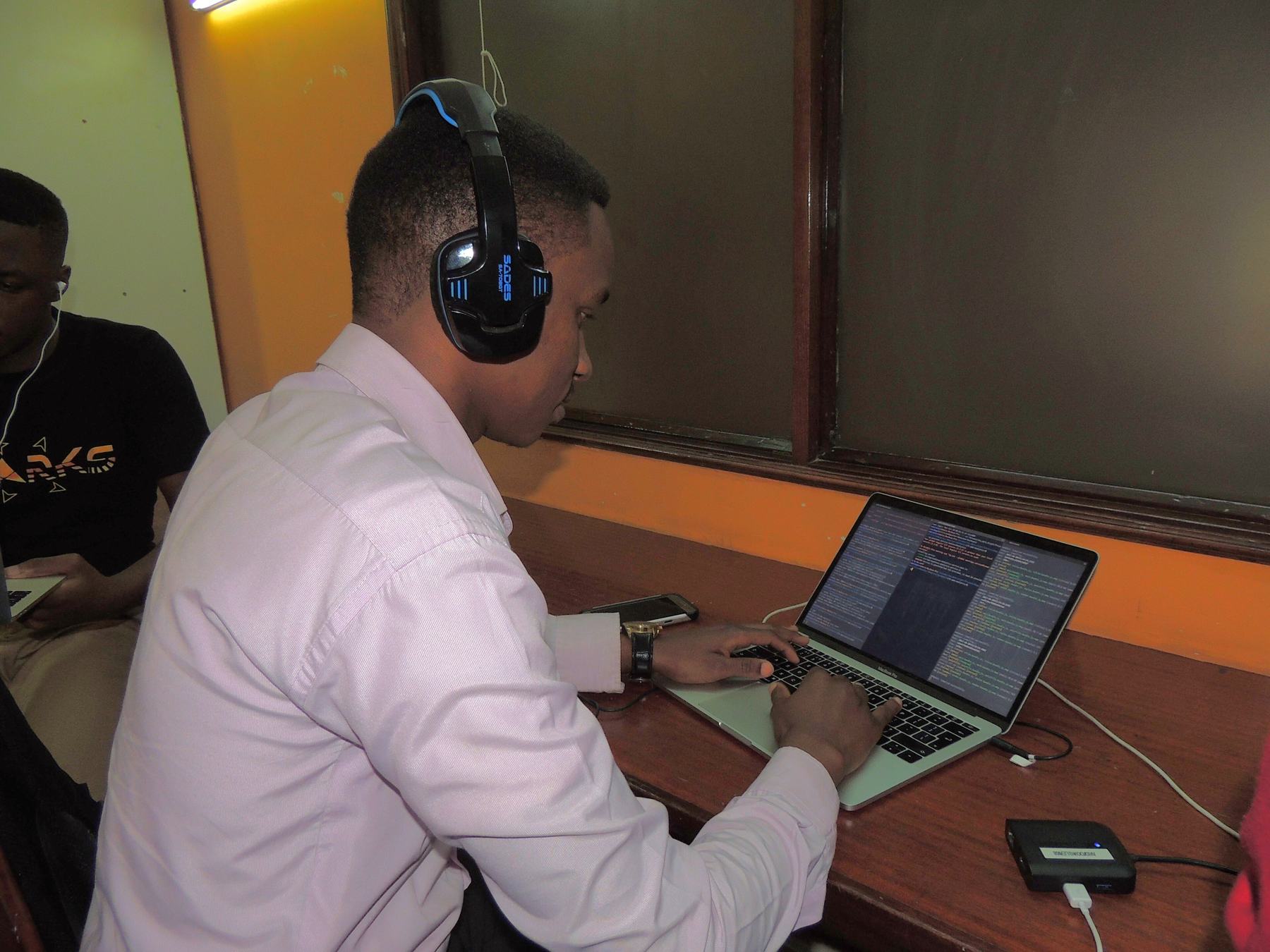 An analyst reviewing data on a laptop