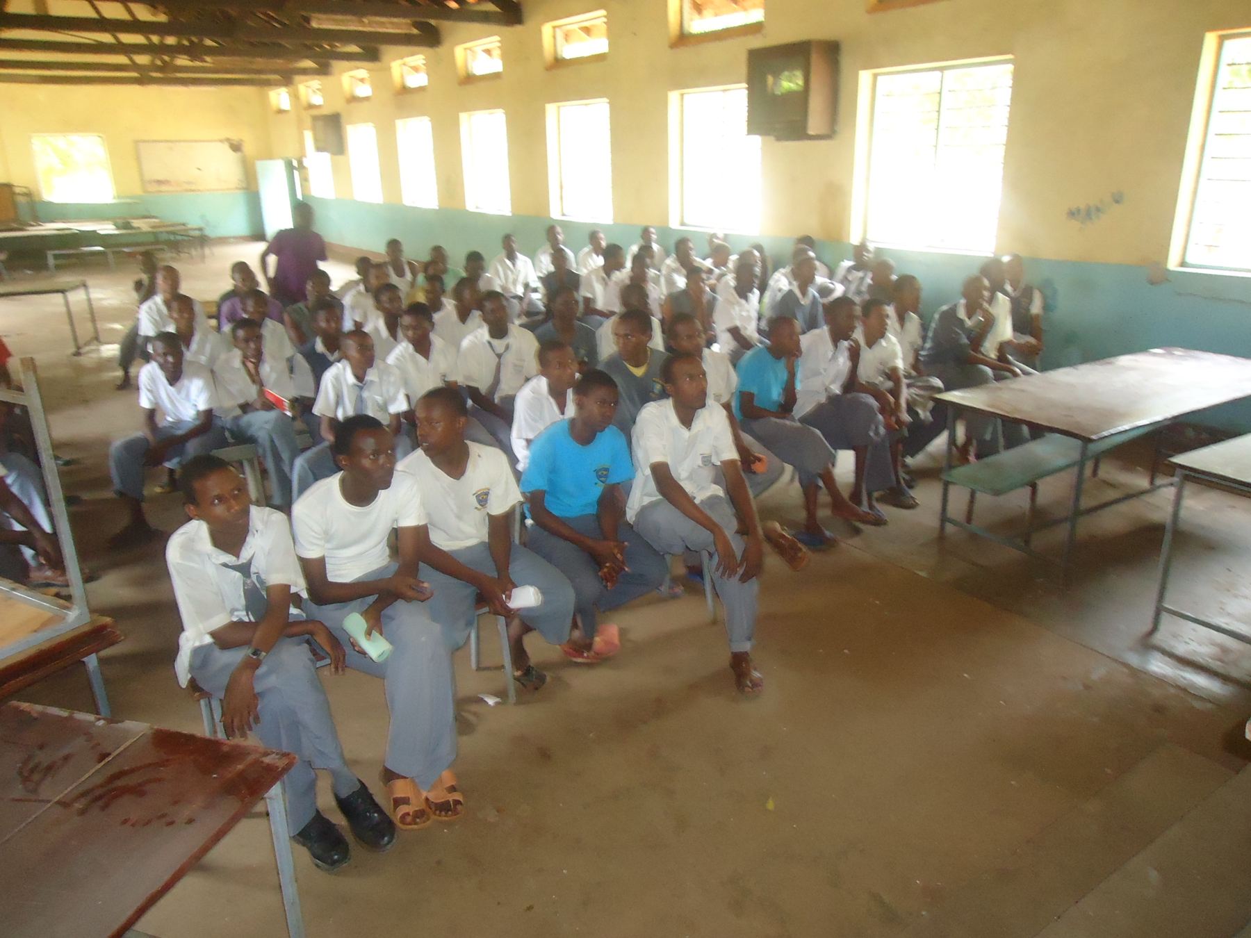 Students seated in a secondary-school dining hall in Kenya